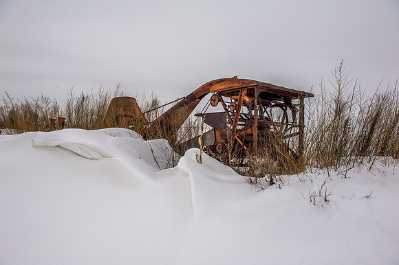 Vintage Farm Equipment Bury in a Snow Drift